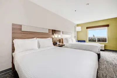 a hotel room with two beds and a window at Holiday Inn Express Hotel & Suites-Edmonton South by IHG in Edmonton
