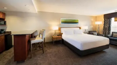 a hotel room with a bed and a desk at Holiday Inn Express Hotel & Suites Sherwood Park-Edmonton Area by IHG in Sherwood Park