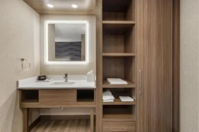 a bathroom with a sink and a mirror at Best Western Plus West Edmonton in Edmonton