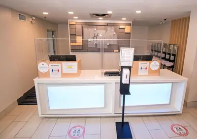 a store counter with boxes on top of it at Holiday Inn Express Hotel & Suites-Hinton by IHG in Hinton