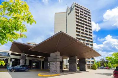 a building with a car parked in front of it at Sandman Signature Vancouver Airport Hotel & Resort in Richmond