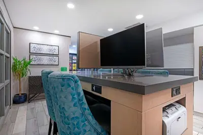 a room with a desk with a television on it at Best Western Plus Sands in Vancouver