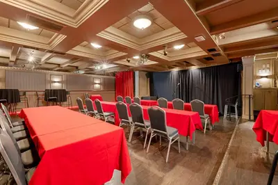 a conference room with red tables and chairs at Best Western Plus Sands in Vancouver