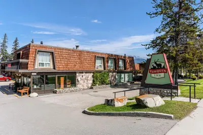 a building with a sign in front of it at Tonquin Inn in Jasper