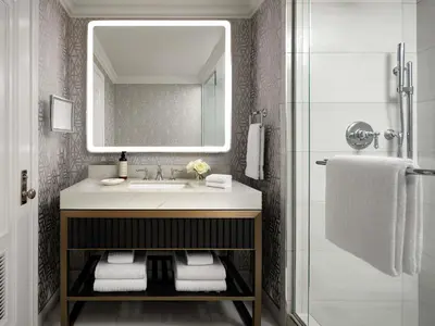 a bathroom with a sink and a mirror at Fairmont Hotel Macdonald in Edmonton