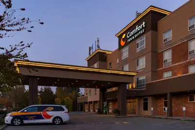 a car parked in front of a hotel at Comfort Inn & Suites in Surrey