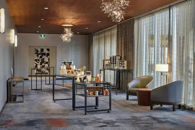 a store with chairs and tables in a room at Calgary Airport Marriott In-Terminal Hotel in Calgary
