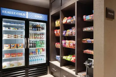 a store refrigerator with food and drinks at Hilton Garden Inn Calgary Downtown in Calgary