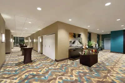 a lobby of a hotel with a carpeted floor at Hilton Garden Inn Calgary Downtown in Calgary