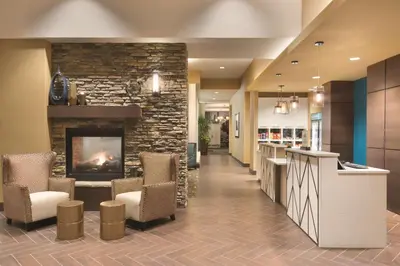 a lobby of a hospital with a fireplace at Homewood Suites by Hilton Calgary Downtown in Calgary