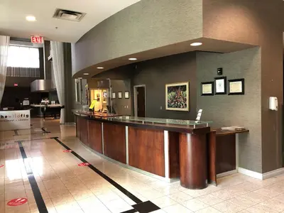 a large lobby with a bar in a hospital at Executive Plaza Hotel & Conference Centre, Metro Vancouver in Coquitlam