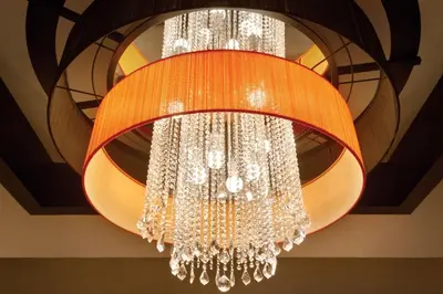 a large chandelier hanging from a ceiling at Coast Coal Harbour Vancouver Hotel by APA in Vancouver