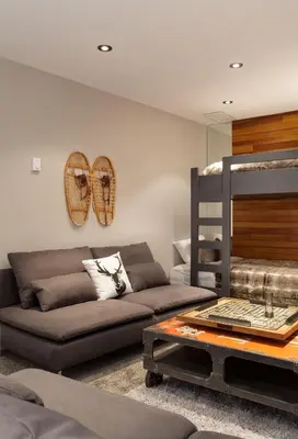 a living room with a couch and a bunk bed at Gibbons Life Accommodations in Whistler