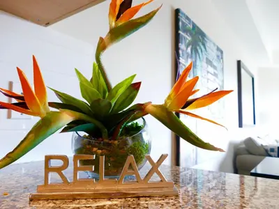 a plant in a glass vase sitting on a table at Copper Oasis in West Kelowna