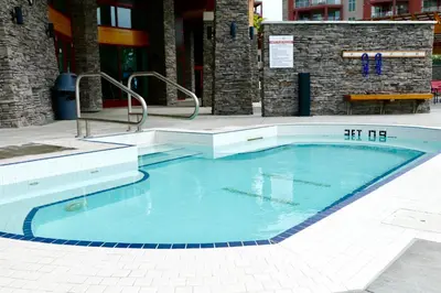 a swimming pool in the middle of a building at Copper Oasis in West Kelowna