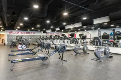 a gym with a bunch of cardio equipment in it at Embarc Vancouver in Vancouver