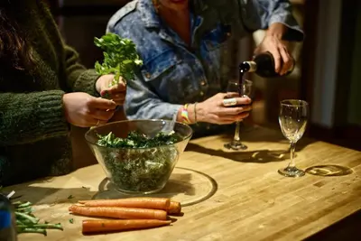 a group of people sitting at a table with wine glasses at Mistiso's Place in Nelson