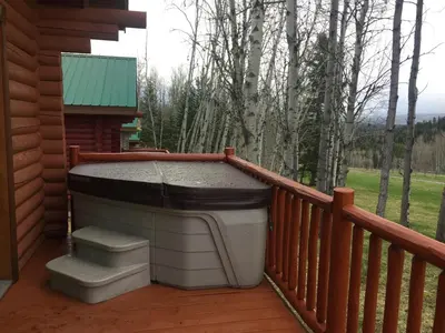 a large barbecue on the deck of a cabin at Montana Hill Guest Ranch in Bridge Lake