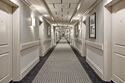 a corridor in a building with a hallway at Chateau Nova Yellowknife in Yellowknife