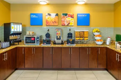 a kitchen with a counter with food on it at Comfort Inn & Suites in Terrace