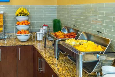 a kitchen with two trays of food on a counter at Comfort Inn & Suites in Terrace