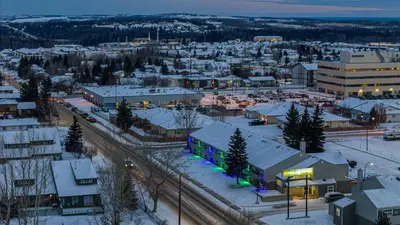 an aerial view of a city in the snow at Northern Lights Inn in Fort Saint John
