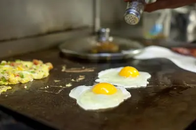 two fried eggs on top of a table at Hillcrest Farm Market B&B in Kelowna