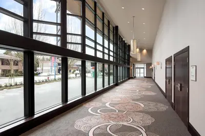 a hallway of a building with a cat rug on the floor at Sheraton Vancouver Airport Hotel in Richmond