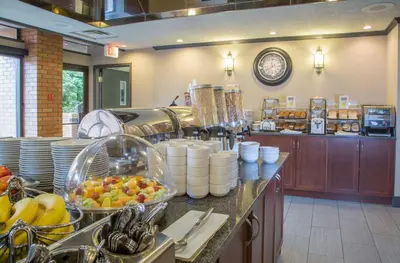 a kitchen with a bunch of food on a counter at The Embassy Inn in Victoria