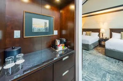 a hotel room with a bed and a bathroom at Charltons Banff in Banff