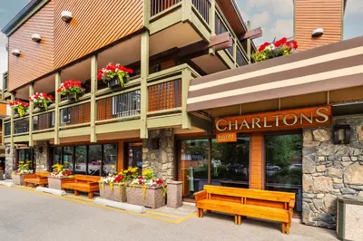 a building with benches in front of it at Charltons Banff in Banff