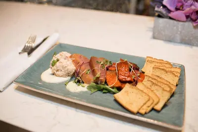 a green plate of food on a table at Victoria Marriott Inner Harbour in Victoria
