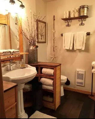 a bathroom with a sink and a toilet at A Suite Retreat - Beyond Bed & Breakfast in Sun Peaks