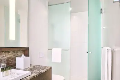a bathroom with a sink and a shower at Civic Hotel, Autograph Collection in Surrey
