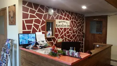 an office with a desk with a computer on it at RANCHLAND Inn in Nanton