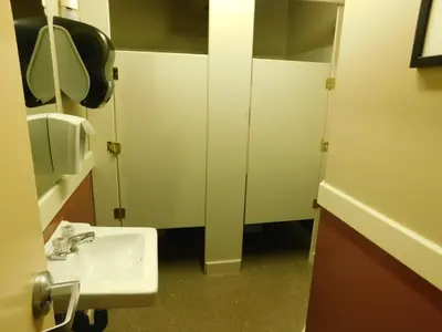a bathroom with a sink and a mirror at Timberland Hotel in Hinton