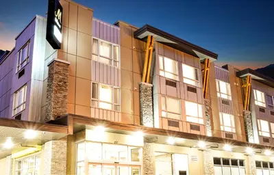 a large building with lights on the side of it at MStar Hotel in Kitimat