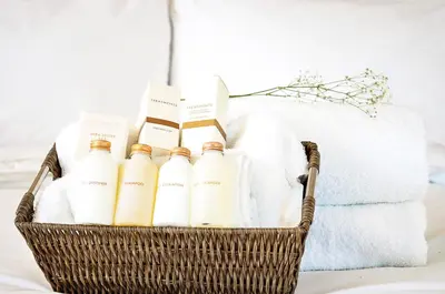 a basket filled with white towels andentedented products at MStar Hotel in Kitimat
