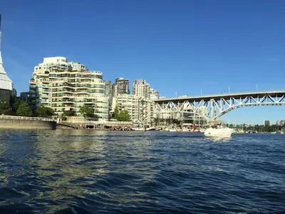 a view of a river with a bridge and buildings at Cozy Bedrooms Guest House in Vancouver