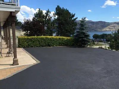 a driveway in front of a house at Heart of Peachland in Peachland