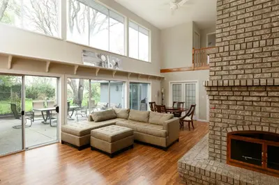 a living room with a couch and a fireplace at Muchen Villa in Delta