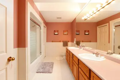 a bathroom with a sink and a toilet and a mirror at Muchen Villa in Delta