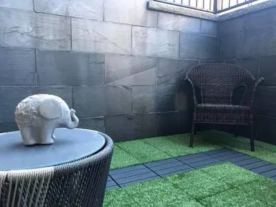 a table with a mask on top of it next to a chair at Boutique in Vancouver