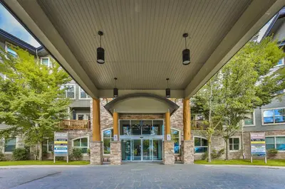 an entrance to a building with a large roof at Silver Rock by StayIn in Fernie