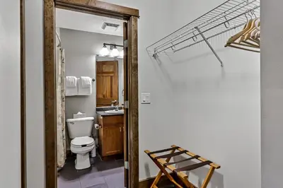 a bathroom with a toilet and a sink at Spacious Mountain 2 Bedroom with Hot tub managed by Little Sister Getaways in Canmore