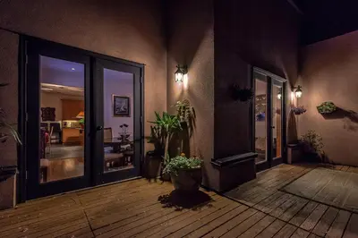 a living room with a wooden floor and a hallway at Whytecliff Park place near ocean in West Vancouver