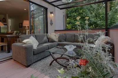 a living room with a couch and a table at Whytecliff Park place near ocean in West Vancouver