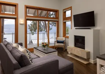 a living room with a couch and a fireplace at Outback Lakeside Vacation Homes in Vernon