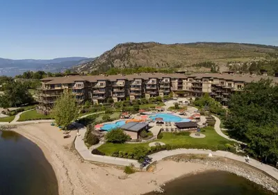 an aerial view of an apartment complex with a resort at The Cove Lakeside Resort in West Kelowna
