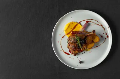 a white plate with food on a table at Courtyard by Marriott Edmonton Downtown in Edmonton